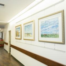 framed artwork in a hallway