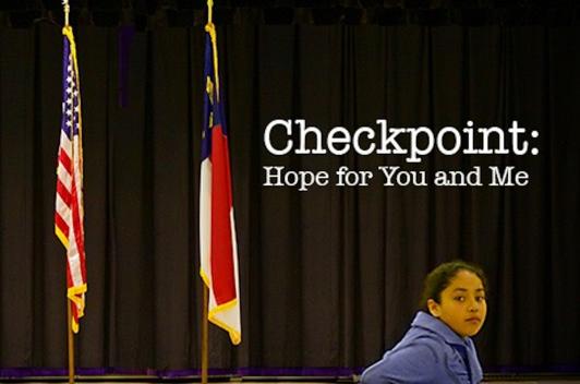 A young person in a blue suit standing in front of a stage with the US flag and the North Carolina flag. Text on the photo reads "Checkpoint: Hope for you and me"