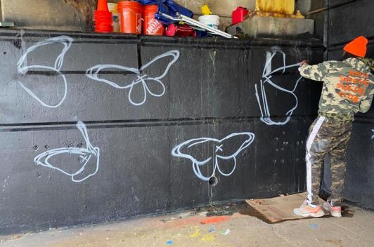 Butterflies being painted as public art