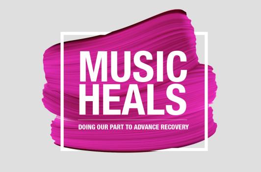 A pink paint stroke is the background for the text, Music Heals.