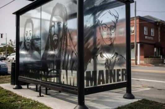Bus stop with paintings of faces representing the artist's friendships