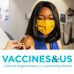 A person in a yellow mask receives a COVID vaccine. The text reads, Vaccine & Us.